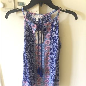 Sleeveless shirt.  Brand new with tags